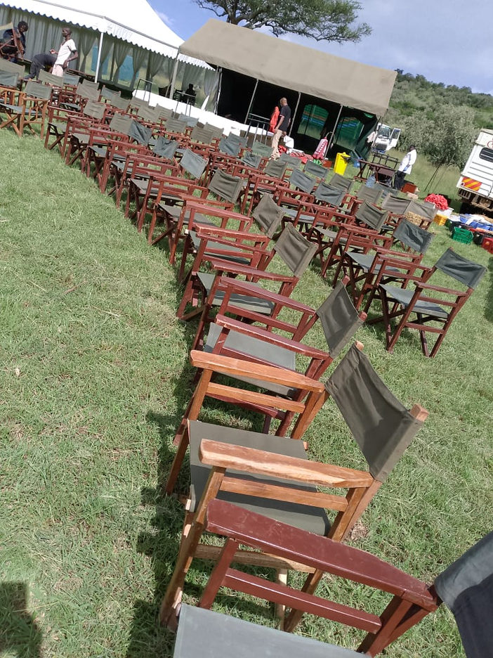 Rows of Chiavari chairs set up outdoors