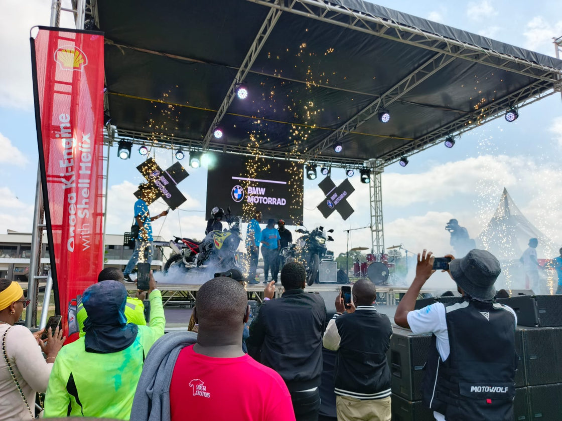 Outdoor stage with a crowd, lighting and cameras