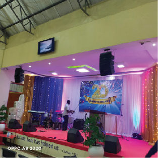 Stage with coloured lighting and a TV screen