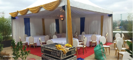 A-frame tents dressed with gold draping